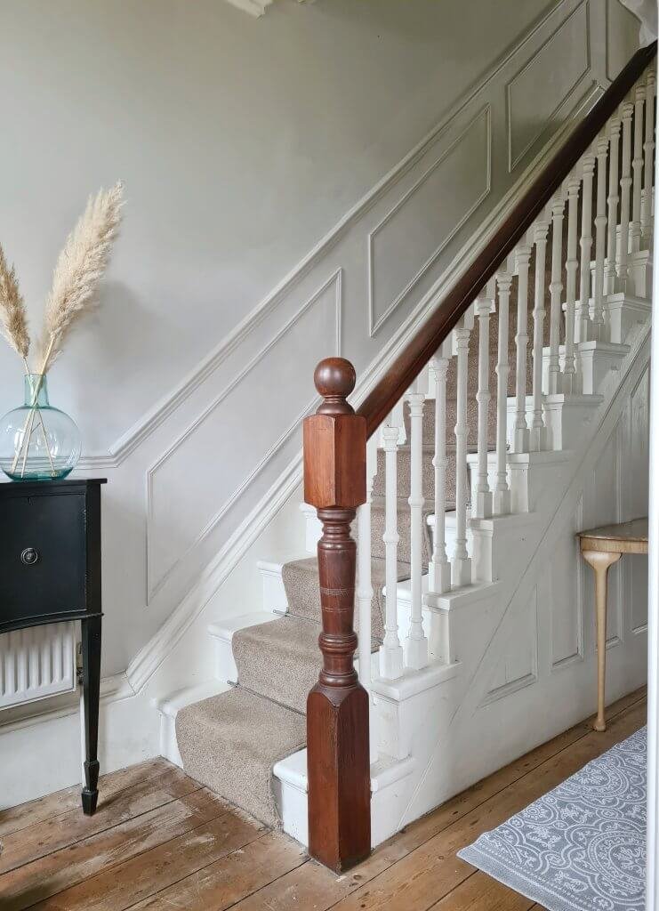 Victorian staircase with original panelled detail and wall panelling painted in Cornforth White. 