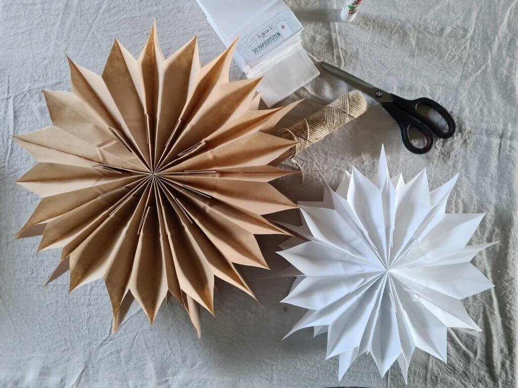 A selection of paper bag stars, both brown and white paper bags
