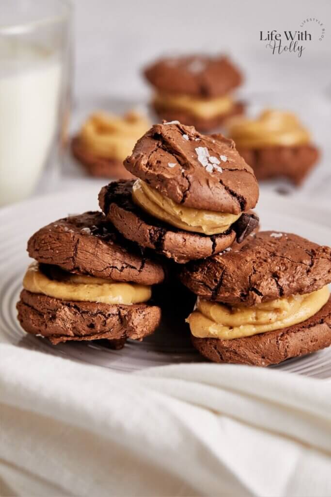 A stack of some homemade peanut butter and chocolate brownie sandwich cookies