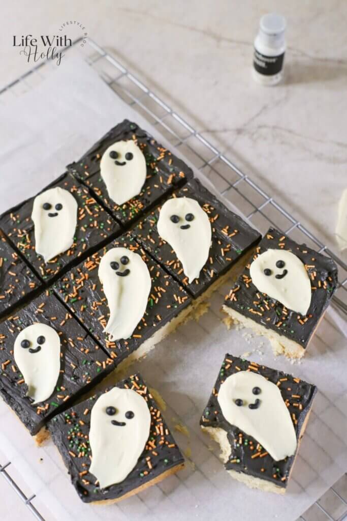 Halloween cookie bar, a shortbread cookie bar with black buttercream and a white chocolate ghost topper