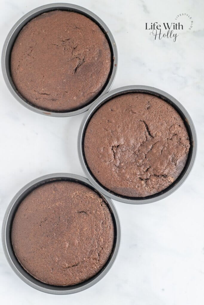 3 chocolate cake tins with cake