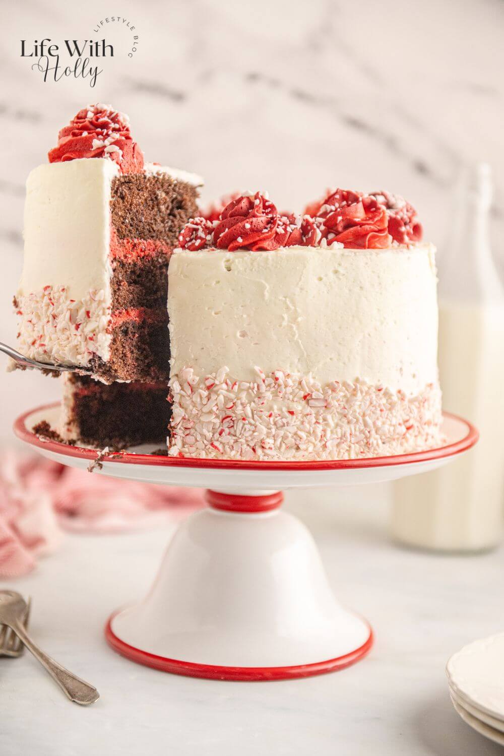 Chocolate peppermint layer cake with a slice being lifted out