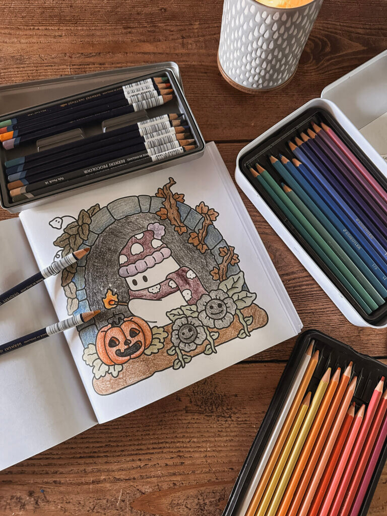 A photo of a coloured in ghost from Spooky Cuties by Coco Wyo